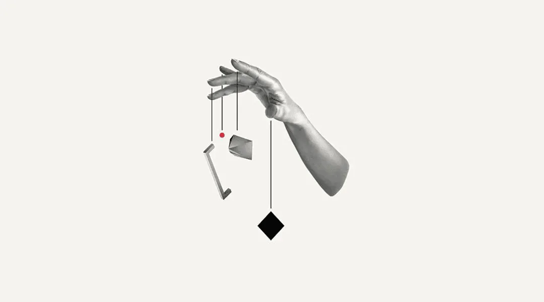 Hand holding geometric shapes on puppet strings