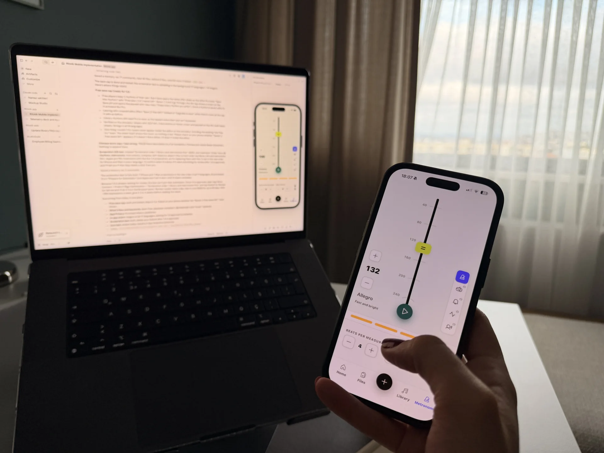 AI-built MVP on a laptop and phone